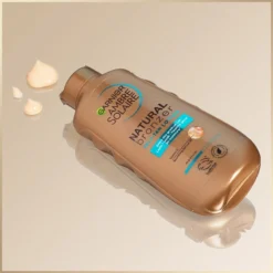 Garnier Ambre Solaire Natural Bronzer -Teint Lisse Soldes Magasin garnier ambre solaire natural bronzer lait teinte pour un bronzage progressif 2